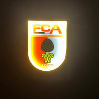 FC Augsburg LED-Leuchtsymbol
Hochwertiges, energieeffizientes LED-Schild mit dem Vereinswappen des FC Augsburg
